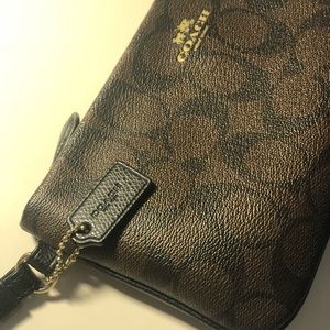 Black and brown Coach wallet wristlet